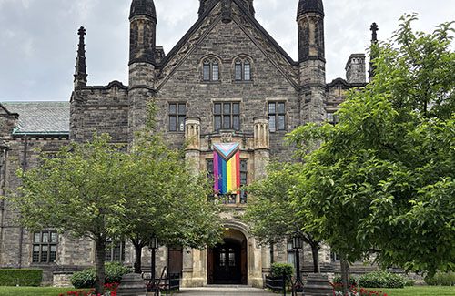 Progress Pride flag on display at front entrance to Trinity College