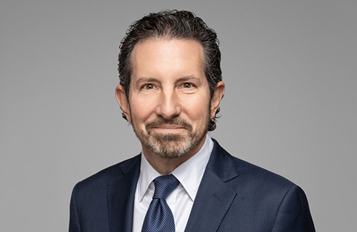 Richard Phillips in a blue suit