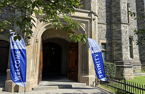 Welcome and Trinity banners at the front entrance to Trinity College