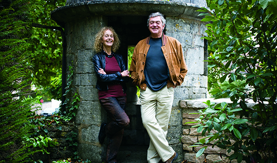 George and Martha stand in front of a tree