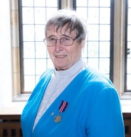Alyson wearing her King Charles III medal