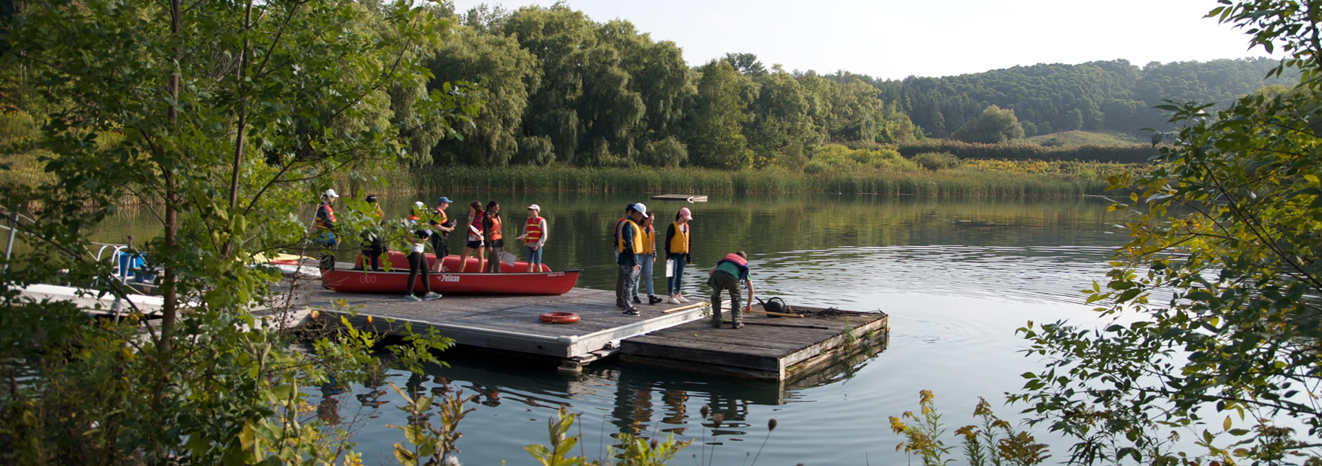 Trinity One students get into canoes on a field trip to Koffler Scientific Reserve
