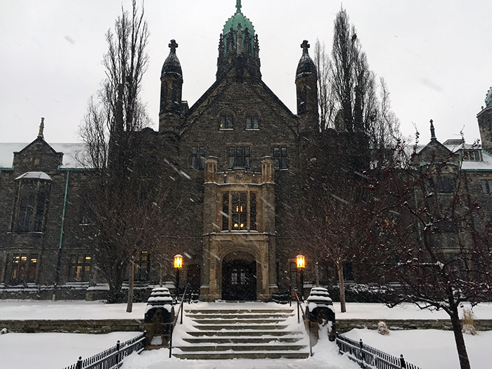 Trinity College frong building along Hoskin Avenue in the winter time