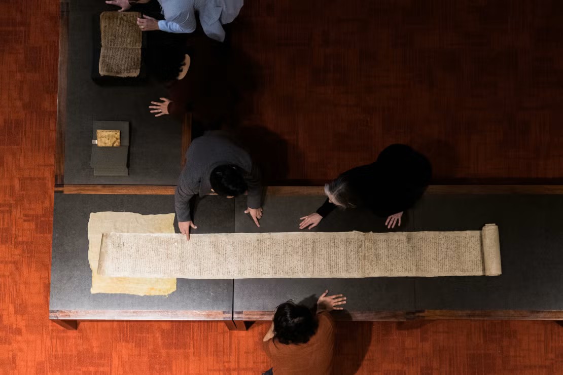 Fisher Rare Books Library - students looking at manuscript